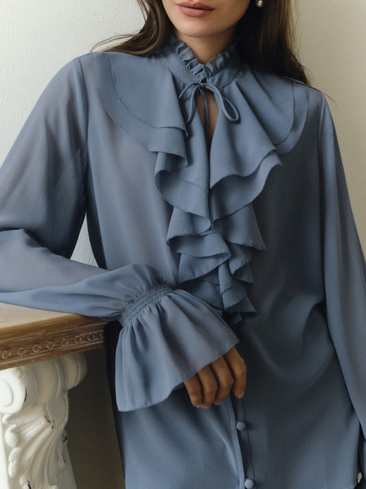 Light blouse with flounces and ties at the collar